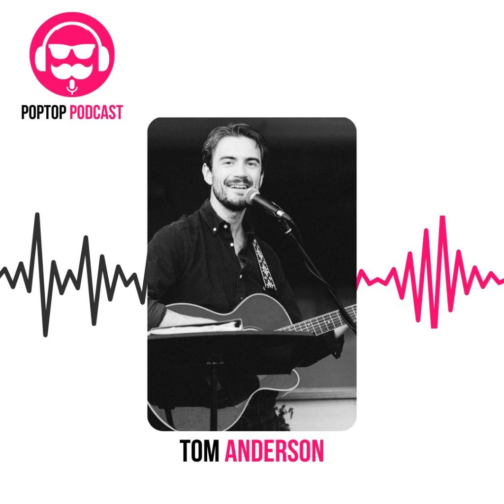 podcast artwork for Tom Anderson - man holding guitar in black shirt