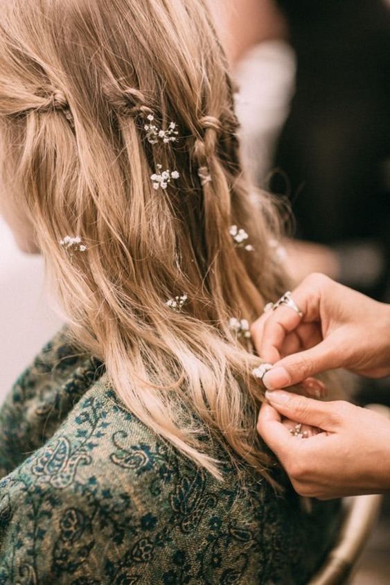 wedding hairstyle with white tiny flowers 