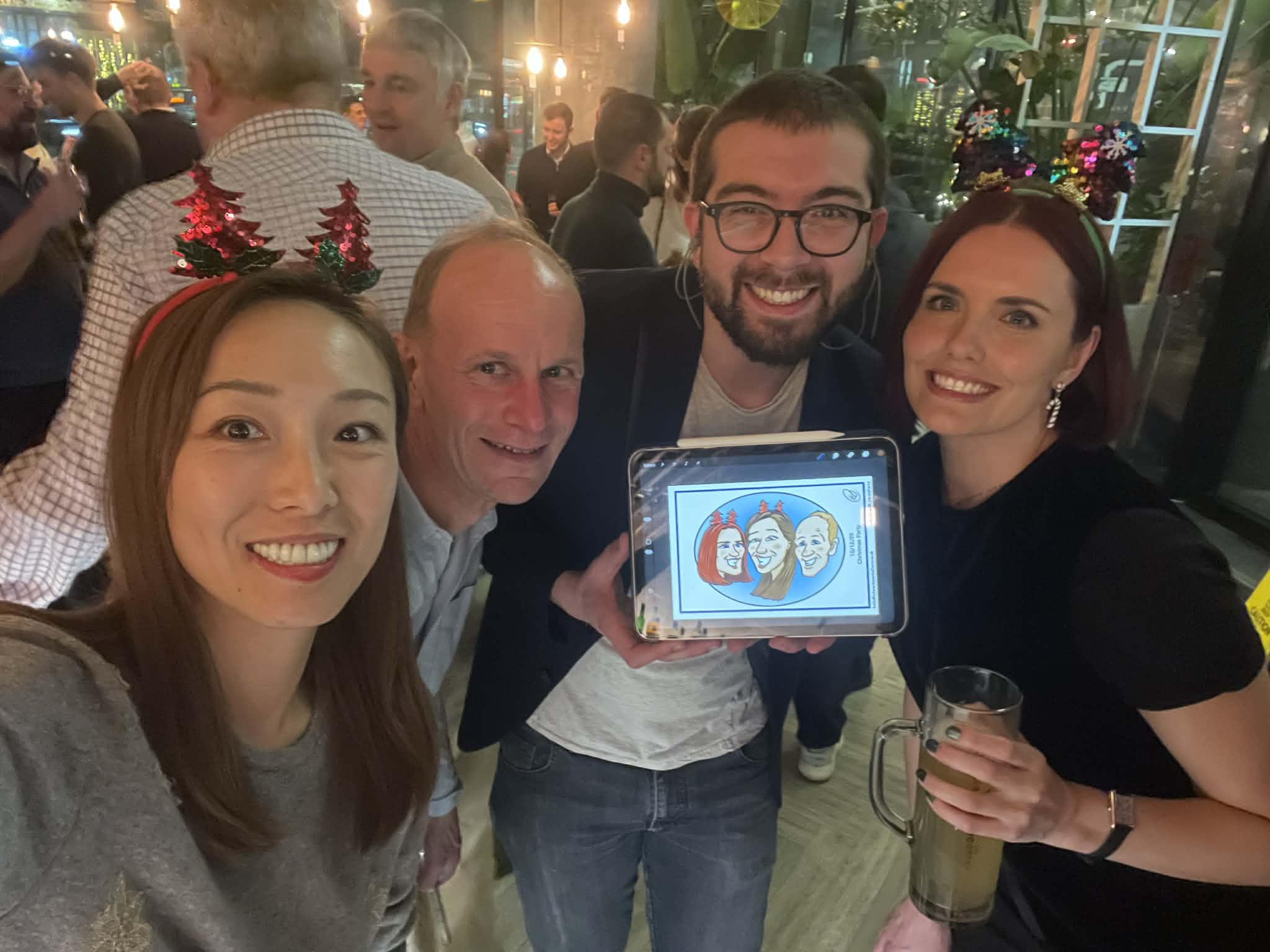 A vibrant workshop captures excited participants, with a digital drawing on an iPad showcasing animated characters celebrating. Bright lighting enhances the engaging atmosphere, highlighting service quality with focused attention and smiling expressions.