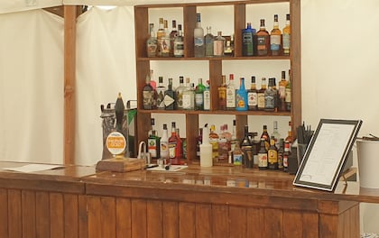 Fully Stocked Cash Bar with our rustic bar and high quality drinks