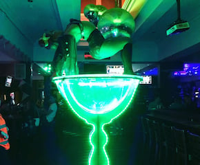 Giant Martini Glass with Performer Impressing Guests with Acrobatic Grace