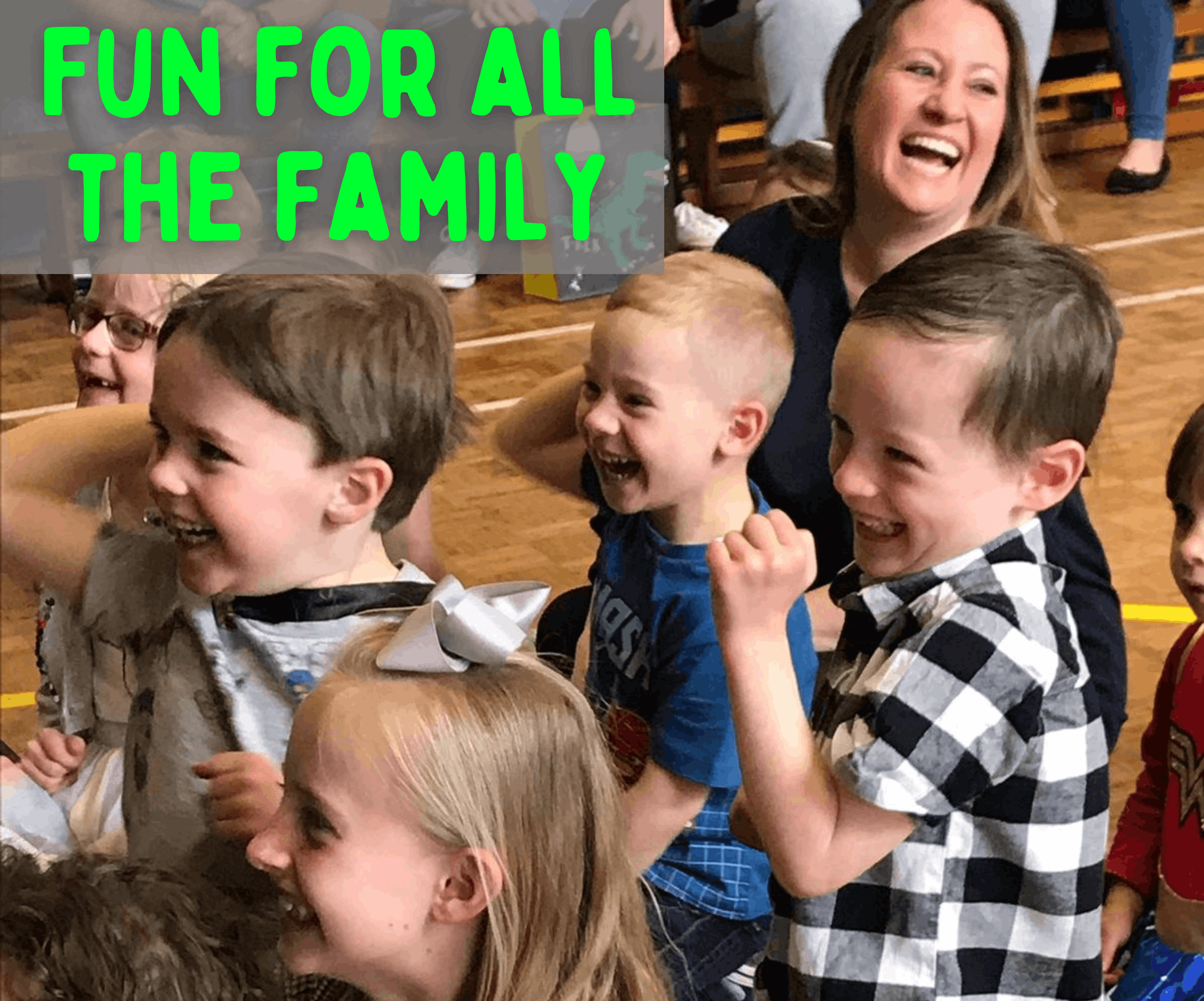 A joyful group of children share laughter in a bright space, enhancing the vibrant atmosphere filled with fun for the whole family.