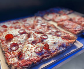 Stone-Baked Sliced Pizza Served Buffet Style on Catering Tricycle