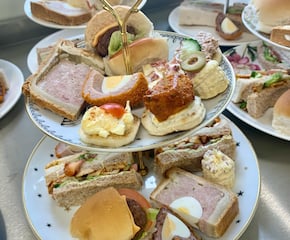 Delicious Afternoon Tea Served on Stylish Three-Tier Stands