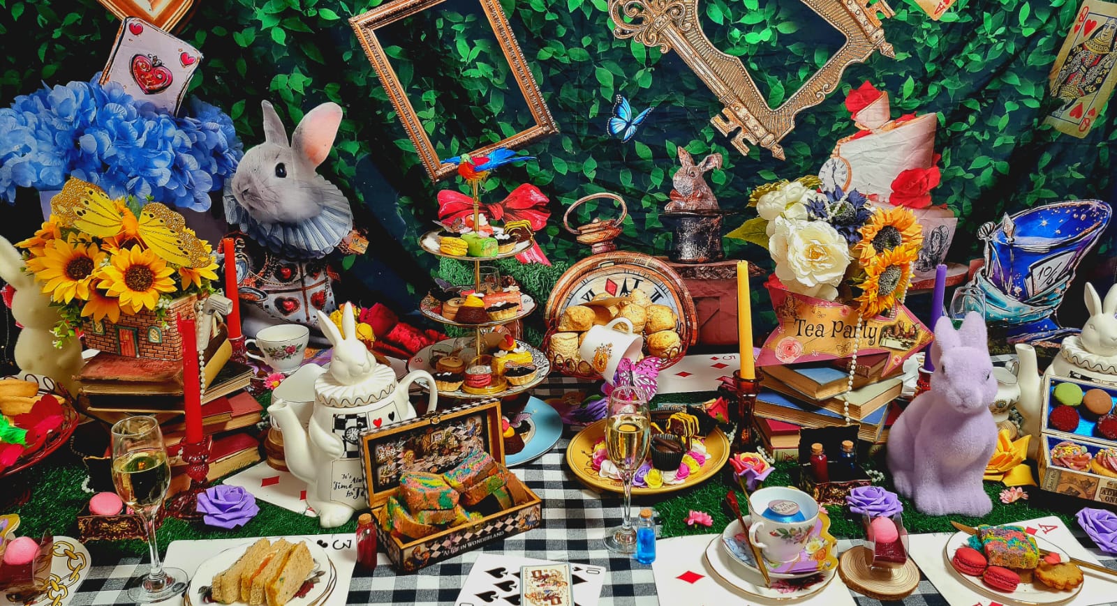 A whimsical tea party scene features colorful pastries, plush bunnies, and vibrant sunflowers, all under soft, enchanting lighting.