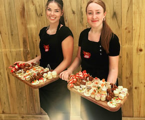 Carefully Prepared Canapés Handed Out on Oak Platters