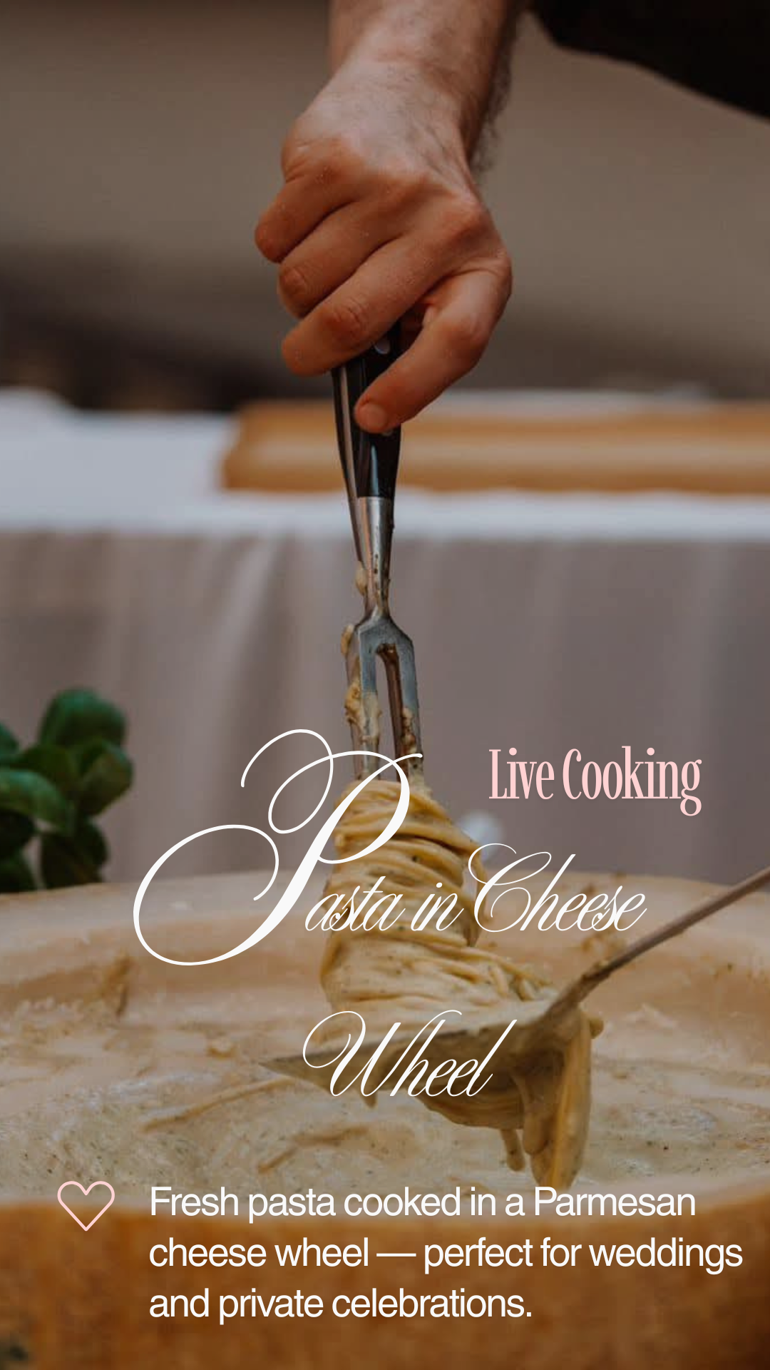 Close-up live cooking of pasta twirled in a Parmesan cheese wheel, warm indoor lighting, polished catering presentation, wedding-ready.
