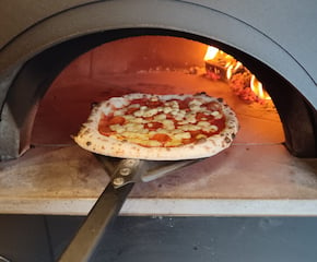 Indulge in the Magic of Wood-Fired, Stone-Baked Pizzas