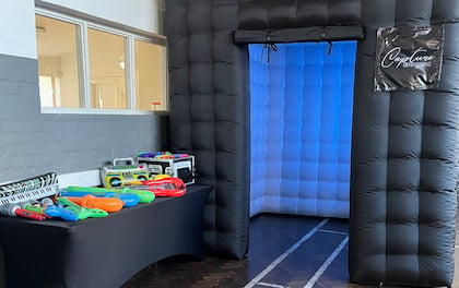 Inflatable Booth with Unlimited Prints, Props & Attendant