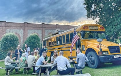 Stacked Burgers Served from Iconic American Yellow School Bus