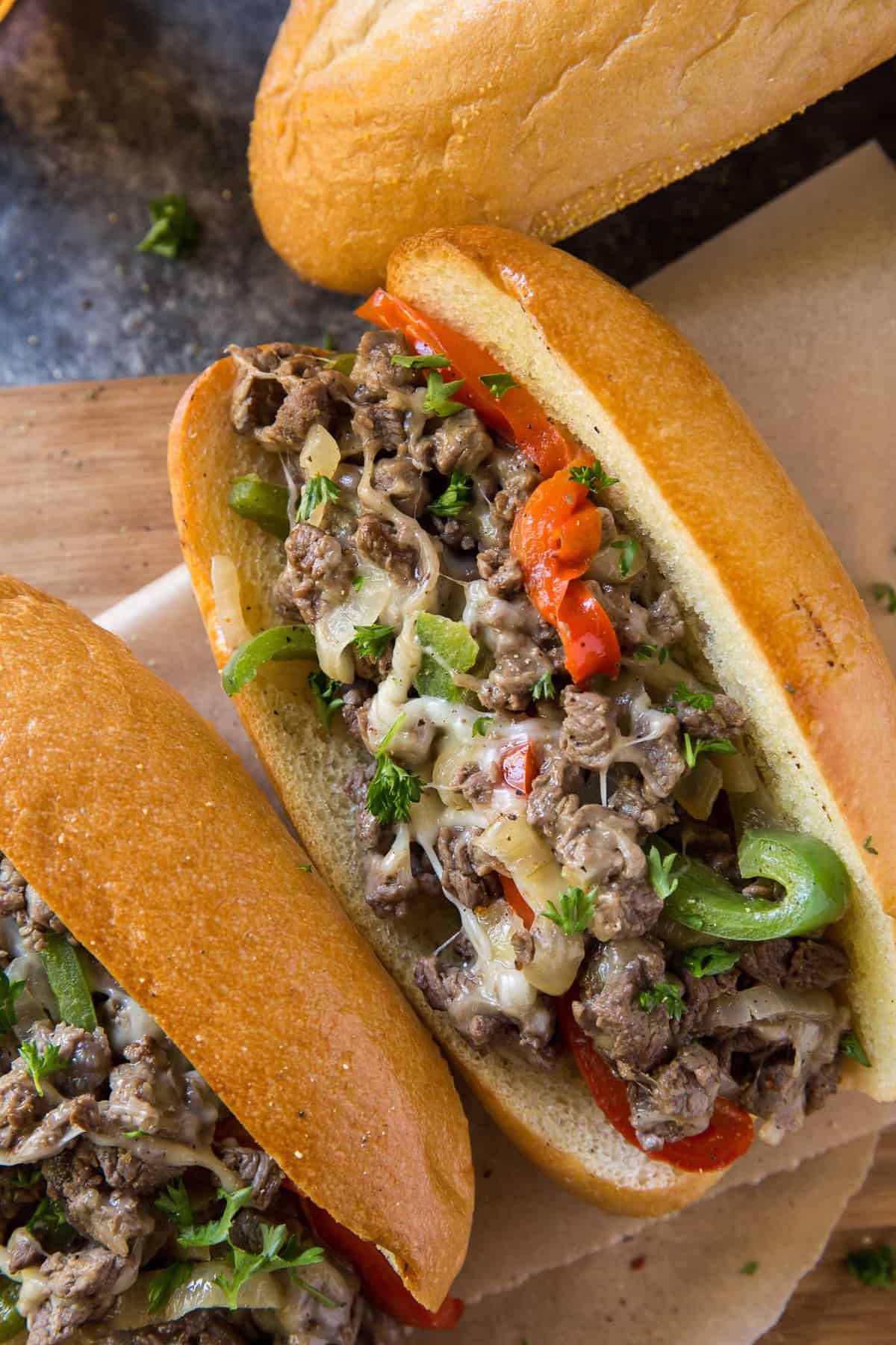 American Philly Cheesesteaks or Garlic Butter Steak Baguettes with Fries