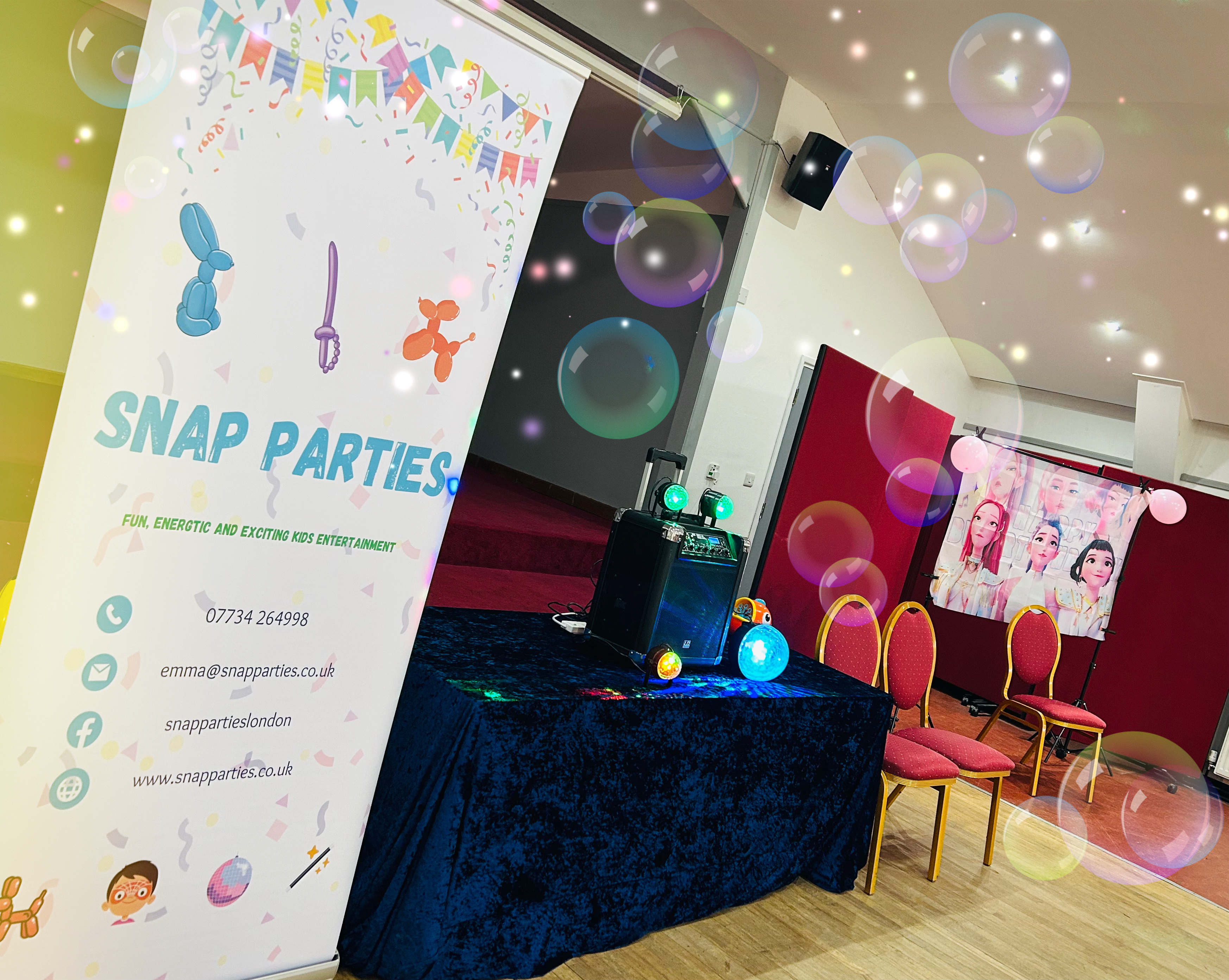 A vibrant party setup features a navy blue tablecloth, colorful lights, and a playful banner, radiating joy in a bright, inviting venue.