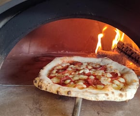 Indulge in the Magic of Wood-Fired, Stone-Baked Pizzas
