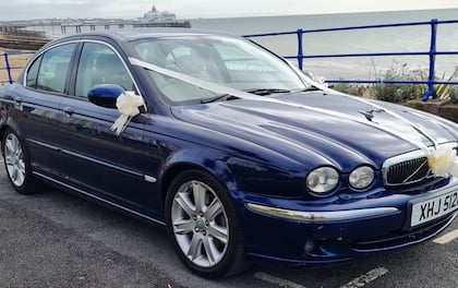 Classic-Style Jaguar Driven by a Professional Chauffeur