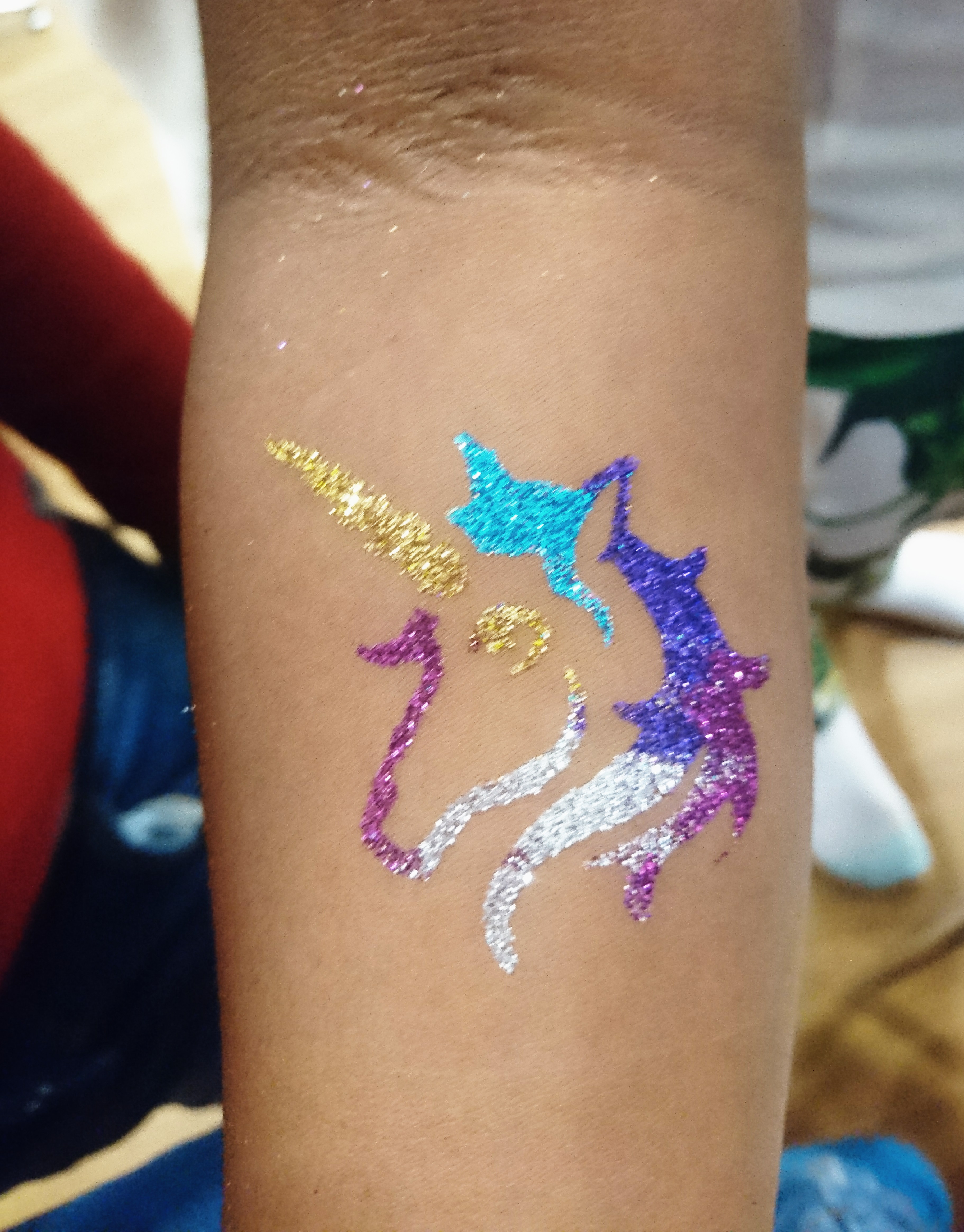 Fun & Colourful Face Painting With Glitter Tattoos