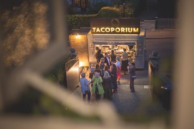 Signature Mexican Tacos Being Served With A Smile