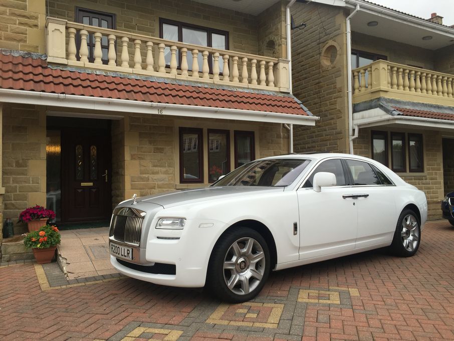 Rolls Royce with Well-Dressed Chauffeurs