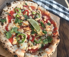 Tasty Neapolitan Wood-Fired Pizza Enjoyed By The Whole Family