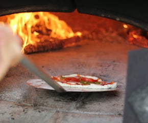 Wood-Fired Pizza Out Of Our One-of-a-kind Vintage Horse Trailer