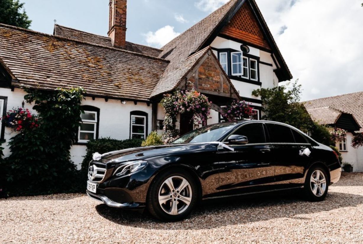 Travel in Style on Your Special Day in our Black Mercedes Benz E 220