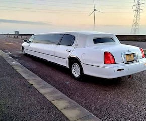 Arrive in Style with a Sleek White Stretch Limo