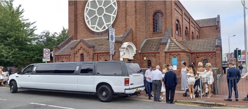 Arrive In Style In Gorgeous Dazzling White   13 -Seater Limo